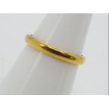 A 22ct gold wedding band, size N½, approximately 3.3 grams all in.