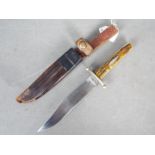 A Victorian Bowie knife by J Rodgers & Sons, Sheffield, with two piece stag horn grip,