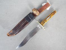 A Victorian Bowie knife by J Rodgers & Sons, Sheffield, with two piece stag horn grip,