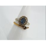 9 ct gold - a 9ct gold stone set ring with one small surrounding stone missing,
