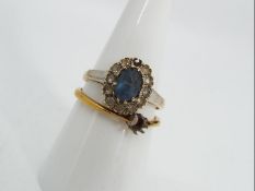 9 ct gold - a 9ct gold stone set ring with one small surrounding stone missing,