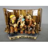 Runnaford Pottery - A Will Young 'Widecombe Fair' figural group of a three character bench