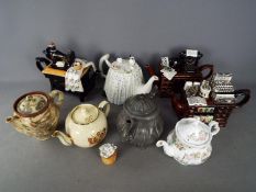 A collection of predominantly ceramic teapots (one pewter) including a Royal Doulton Brambly Hedge