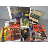 A collection of literature to include war related magazines,