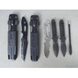 A pair of survival boot knives one black and one stainless steel,