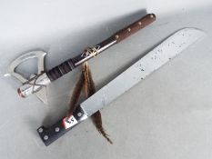 A replica WW2 marine machete and a replica Native American tomahawk.