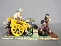 Runnaford Pottery - A Will Young 'Widecombe Fair' figural group 'Coming From The Fair',