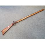 A replica Italian made Kentucky black powder flintlock hunting rifle in .45 cal.