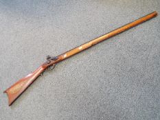 A replica Italian made Kentucky black powder flintlock hunting rifle in .45 cal.