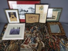 A collection of prints, a mirror, tapestry and similar.