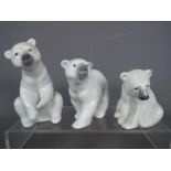 Lladro - Three Lladro polar bear figurines, largest approximately 12 cm (h).