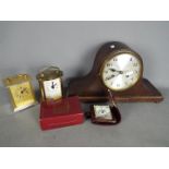 A small collection of clocks including an oak cased Napoleons hat mantel clock.