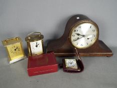 A small collection of clocks including an oak cased Napoleons hat mantel clock.