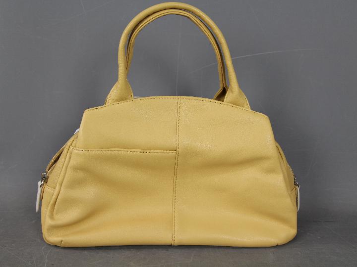 A lady's mustard coloured handbag marked Radley - Image 2 of 2