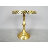 A good quality brass pedestal stand with pierced decoration, approximately 25 cm (h).