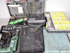Lot to include a power drill, precision electric saw, AA car maintenance course,