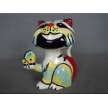 A Lorna Bailey cat holding a butterfly, signed to the base, approximately 12.5 cm (h).