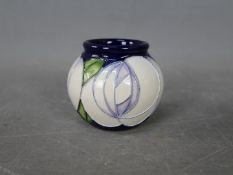 Moorcroft - a Moorcroft vase in the White Rose design, approx height 5.