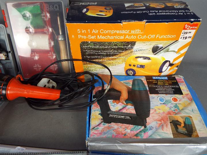 A selection of various tools to include a 5 in 1 air compressor, glue gun, hand saws and similar. - Image 3 of 4