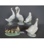 Four Nao geese figurines and a chicken group, largest approximately 15 cm (h).
