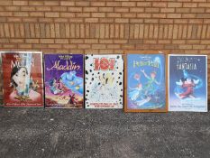 Five framed Disney animated film posters, approximately 87 cm x 63 cm.