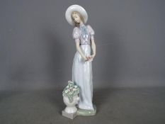 Lladro - A large Lladro figurine entitled 'Blossom of the Heart', impressed # 6782 to the base,