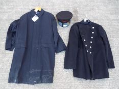A fire brigade tunic with Bootle Fire Brigade buttons with an overcoat and peaked cap.