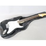 A Pitchmaster six string electric guitar in black finish with carry case.