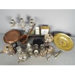 A mixed lot of metalware to include plated, brass, copper.