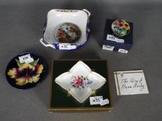 A small mixed lot of ceramics to include a Moorcroft Pottery trinket dish decorated with hibiscus