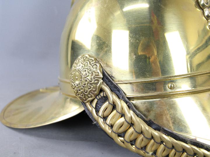 A fireman's brass helmet (reproduction). - Image 3 of 10