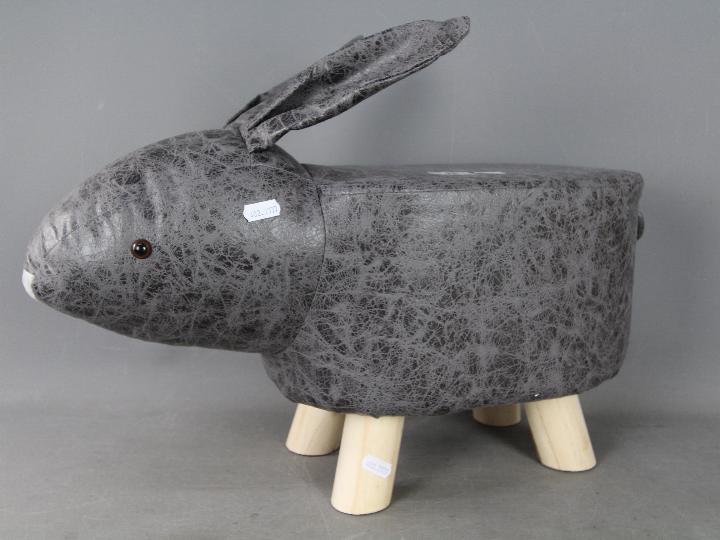 A footstool in the shape of a rabbit,