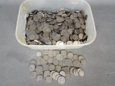 A large quantity of one and two shilling coins 1947 and later.