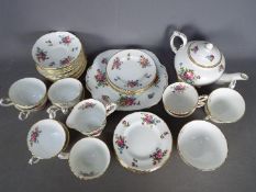 A Crown Staffordshire floral pattern tea service, approximately 40 pieces.