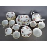 A Crown Staffordshire floral pattern tea service, approximately 40 pieces.