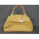 A lady's mustard coloured handbag marked Radley