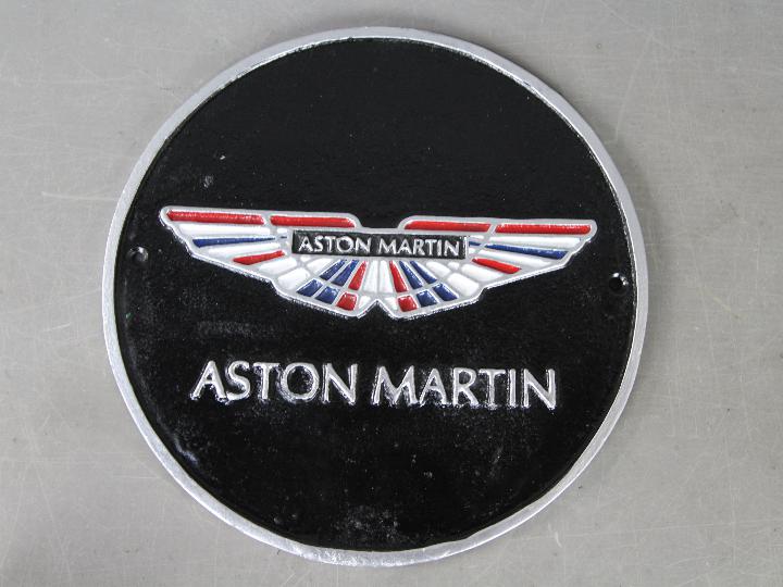 A cast Aston Martin sign,