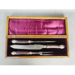 A Victorian silver mounted, horn handled, three piece carving set in fitted case.