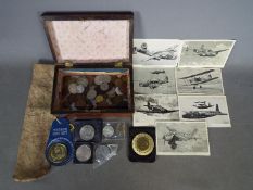 A wooden box containing a small quantity of coins, Victorian and later,