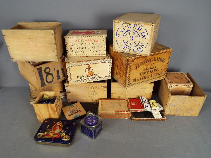 A collection of vintage tea crates / boxes, cigar boxes, vintage tins and similar.