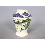 Moorcroft - A small Moorcroft Pottery vase decorated in the Juneberry pattern,