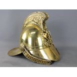 A fireman's brass helmet (reproduction).