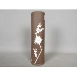 A brown Wedgwood Jasperware vase decorated with flowering prunus, impressed marks to the base,