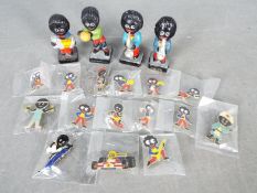 A small collection of Robertsons 'Golly' badges, hand painted band figures and similar.