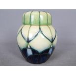Moorcroft - A Moorcroft Pottery ginger jar in the Indigo pattern, stamped to the base and dated '99,