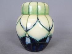 Moorcroft - A Moorcroft Pottery ginger jar in the Indigo pattern, stamped to the base and dated '99,