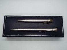 Two silver plated pencils