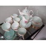 Royal Albert - An 'Elfin' pattern tea service comprising, teapot, sugar bowl, cream jug,