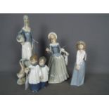 Four Spanish porcelain figurines to include Nao D'Art and similar,