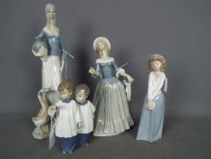 Four Spanish porcelain figurines to include Nao D'Art and similar,